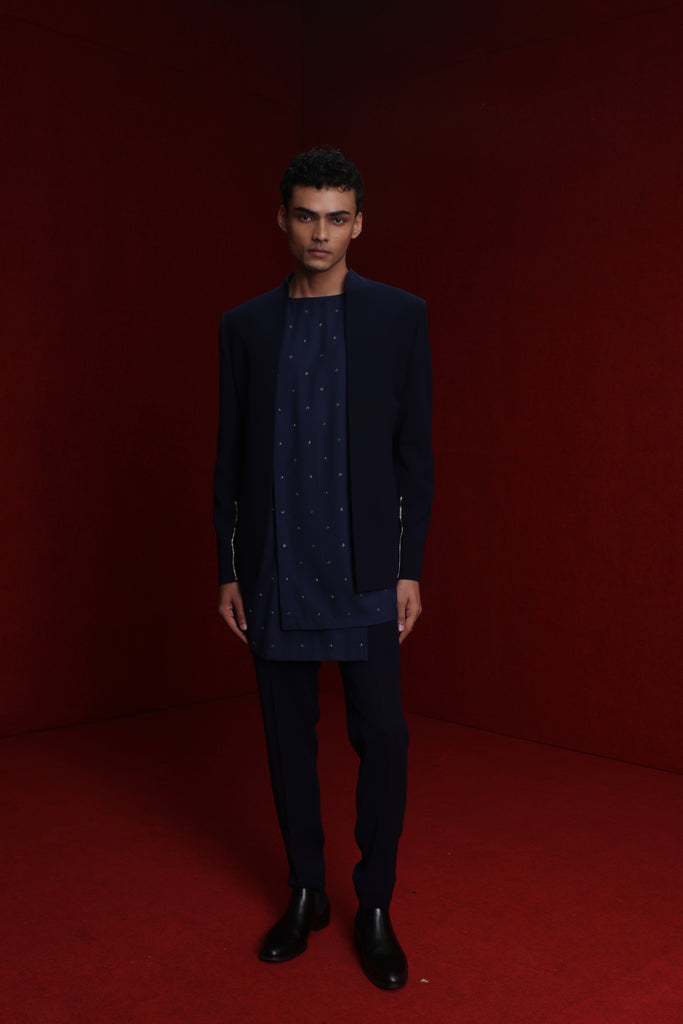 NAVY BLUE INDOWESTERN WITH GOLD DETAIL ON SLEEVES PAIRED WITH TONAL ALL OVER EMB ASYM KURTA AND FITTED PANTS