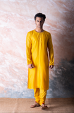 Canary yellow embroidered chanderi kurta paired with yellow churidar