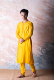 Canary yellow embroidered chanderi kurta paired with yellow churidar