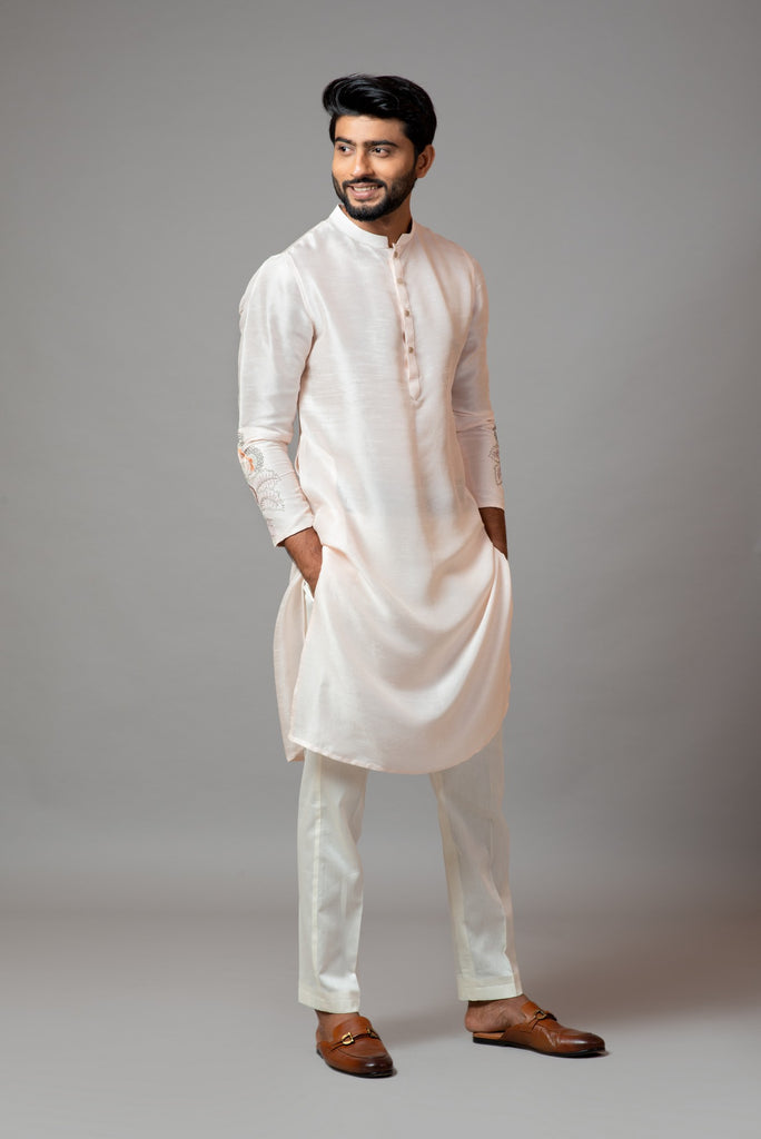 PLAIN KURTA WITH MINIMAL FLORAL EMBROIDERY ON SLEEVES