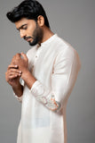 PLAIN KURTA WITH MINIMAL FLORAL EMBROIDERY ON SLEEVES