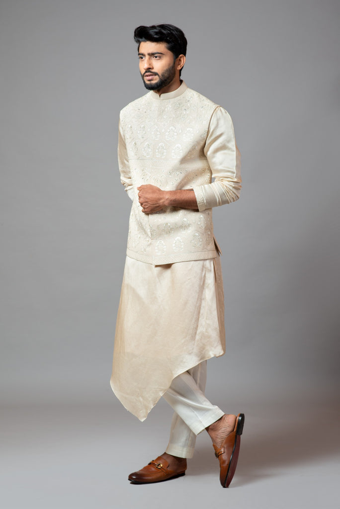 CREAM KORA FULLY EMBROIDERED NEHRU PAIRED WITH DRAPE KURTA AND PANT PAJAMA