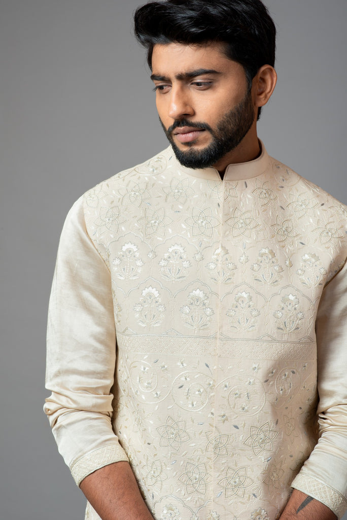 CREAM KORA FULLY EMBROIDERED NEHRU PAIRED WITH DRAPE KURTA AND PANT PAJAMA