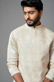 CREAM KORA FULLY EMBROIDERED NEHRU PAIRED WITH DRAPE KURTA AND PANT PAJAMA