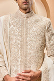 Ivory sherwani detailing with gold zari ,pearl,sequins and spring work