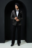 Black tuxedo highlighted with silver zari  and peals