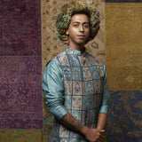TEAL BLUE KURTA WITH EMBROIDERY PAIRED WITH PATCHWORK PRINT BUNDI