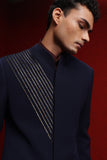 Navy blue indowestern with diagonal detail on one side paired with burgundy broad stand kurta and navy blue fitted pants