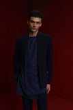 Navy blue indowestern with gold detail on sleeves paired with tonal all over emb asym kurta and fitted pants