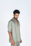 Green Shirt with Purple Pipin