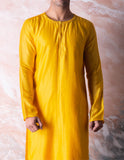 Canary yellow embroidered chanderi kurta paired with yellow churidar