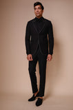 Black peak lapel suit with all over white outline