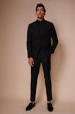 Black suit with inverted embroidered triangle on lapel,flap