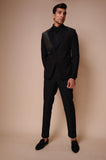 Black peak lapel suit with diagonal gold textured lines across chest