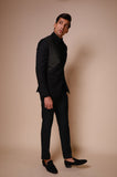 Black peak lapel suit with diagonal gold textured lines across chest